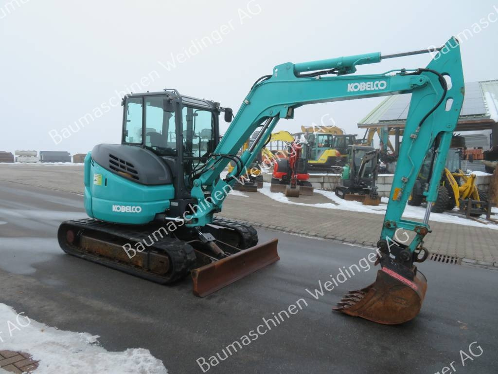 Kobelco SK 55 SRX-6 - Minikuormaaja: kuva Kobelco SK 55 SRX-6 - Minikuormaaja Kobelco SK 55 SRX-6 - Minikuormaaja: kuva Kobelco SK 55 SRX-6 - Minikuormaaja