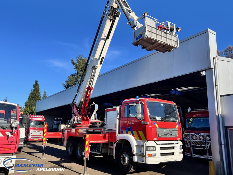 MAN TGA 26.350 Magirus ALP 320L = 32 meter, Waterpump, 6x4, Steel springs - Kuorma-auto: kuva MAN TGA 26.350 Magirus ALP 320L = 32 meter, Waterpump, 6x4, Steel springs - Kuorma-auto MAN TGA 26.350 Magirus ALP 320L = 32 meter, Waterpump, 6x4, Steel springs - Kuorma-auto: kuva MAN TGA 26.350 Magirus ALP 320L = 32 meter, Waterpump, 6x4, Steel springs - Kuorma-auto