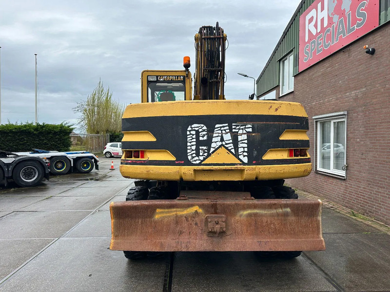 Caterpillar M315 +ROTO CE - Pyöräalustainen kaivinkone: kuva Caterpillar M315 +ROTO CE - Pyöräalustainen kaivinkone Caterpillar M315 +ROTO CE - Pyöräalustainen kaivinkone: kuva Caterpillar M315 +ROTO CE - Pyöräalustainen kaivinkone
