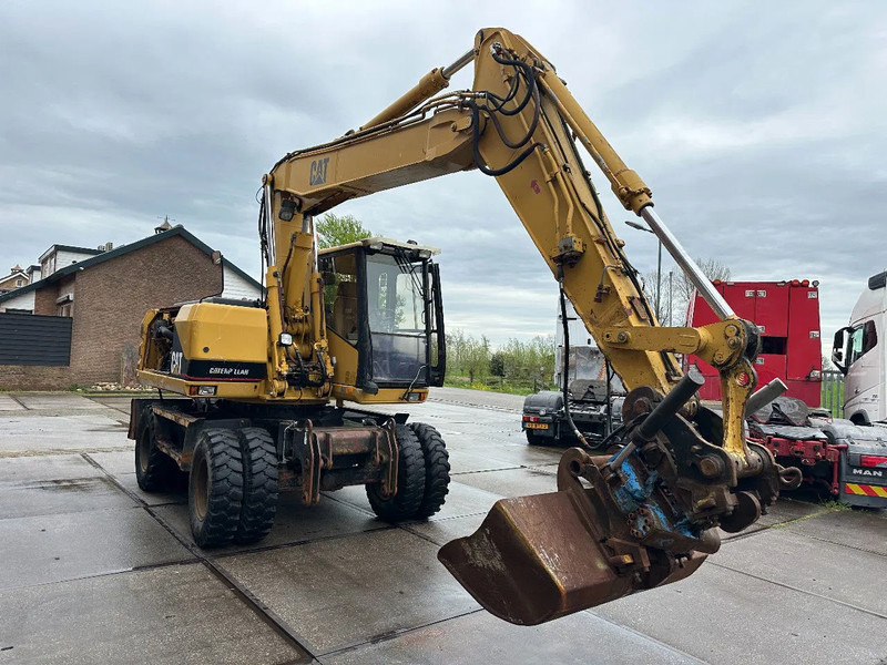 Caterpillar M315 +ROTO CE - Pyöräalustainen kaivinkone: kuva Caterpillar M315 +ROTO CE - Pyöräalustainen kaivinkone Caterpillar M315 +ROTO CE - Pyöräalustainen kaivinkone: kuva Caterpillar M315 +ROTO CE - Pyöräalustainen kaivinkone