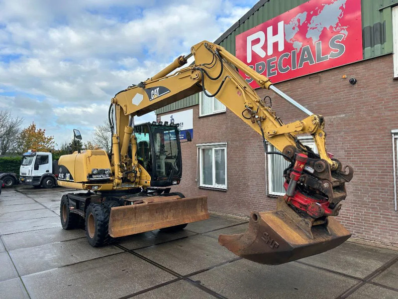 Caterpillar M315C WITH ROTOTILT, CE - Pyöräalustainen kaivinkone: kuva Caterpillar M315C WITH ROTOTILT, CE - Pyöräalustainen kaivinkone Caterpillar M315C WITH ROTOTILT, CE - Pyöräalustainen kaivinkone: kuva Caterpillar M315C WITH ROTOTILT, CE - Pyöräalustainen kaivinkone