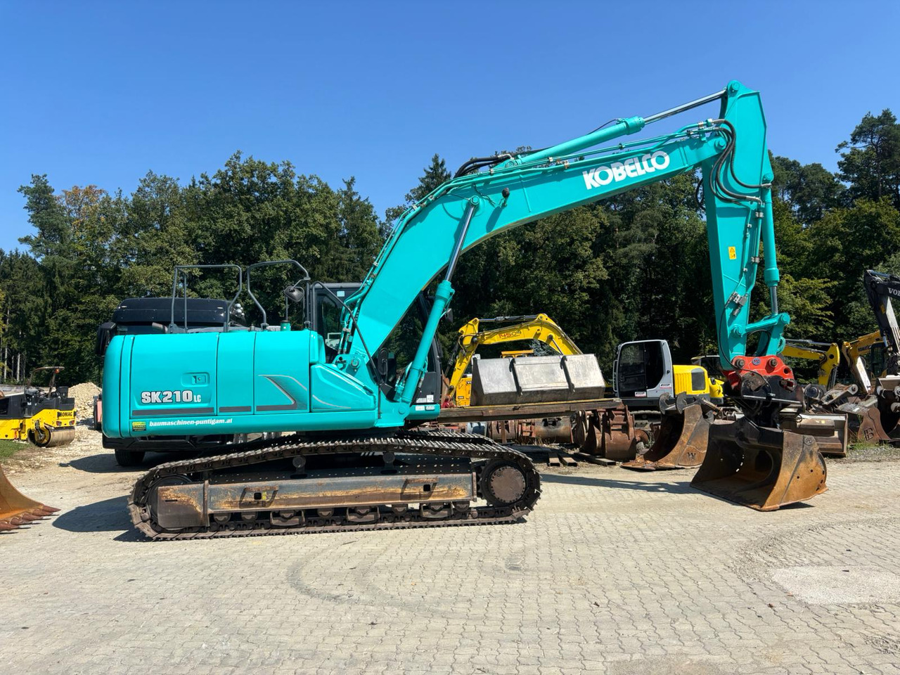 KOBELCO SK 210 NLC-9 - Telakaivukone: kuva KOBELCO SK 210 NLC-9 - Telakaivukone KOBELCO SK 210 NLC-9 - Telakaivukone: kuva KOBELCO SK 210 NLC-9 - Telakaivukone