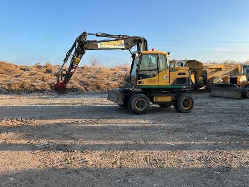 Volvo EXCAVATOR EW140D - Pyöräalustainen kaivinkone: kuva Volvo EXCAVATOR EW140D - Pyöräalustainen kaivinkone Volvo EXCAVATOR EW140D - Pyöräalustainen kaivinkone: kuva Volvo EXCAVATOR EW140D - Pyöräalustainen kaivinkone