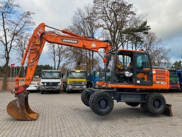 Doosan DX 160 W-3 - Pyöräalustainen kaivinkone: kuva Doosan DX 160 W-3 - Pyöräalustainen kaivinkone Doosan DX 160 W-3 - Pyöräalustainen kaivinkone: kuva Doosan DX 160 W-3 - Pyöräalustainen kaivinkone
