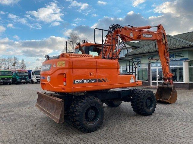 Doosan DX 160 W-3 - Pyöräalustainen kaivinkone: kuva Doosan DX 160 W-3 - Pyöräalustainen kaivinkone Doosan DX 160 W-3 - Pyöräalustainen kaivinkone: kuva Doosan DX 160 W-3 - Pyöräalustainen kaivinkone