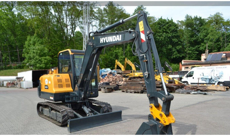 Hyundai HX55 Mini lánctalpas forgókotró - Minikuormaaja: kuva Hyundai HX55 Mini lánctalpas forgókotró - Minikuormaaja Hyundai HX55 Mini lánctalpas forgókotró - Minikuormaaja: kuva Hyundai HX55 Mini lánctalpas forgókotró - Minikuormaaja