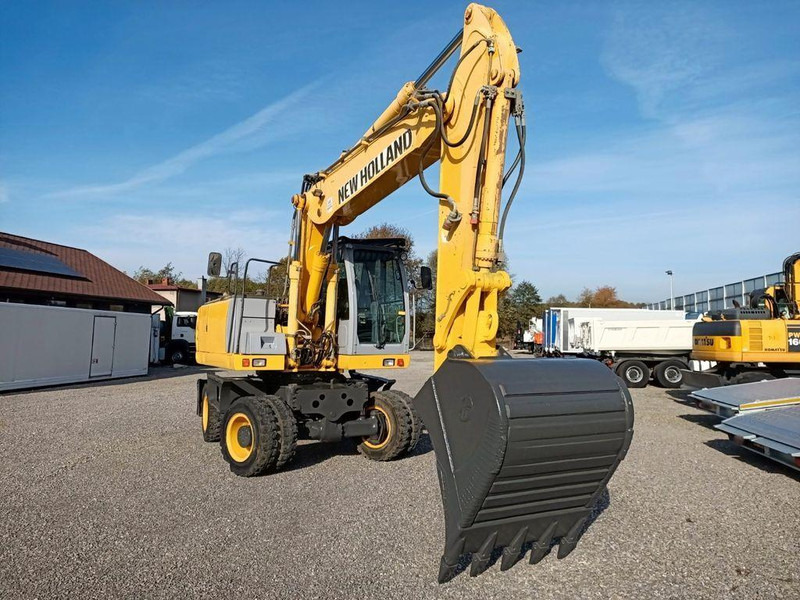 New Holland WE 190 - Pyöräalustainen kaivinkone: kuva New Holland WE 190 - Pyöräalustainen kaivinkone New Holland WE 190 - Pyöräalustainen kaivinkone: kuva New Holland WE 190 - Pyöräalustainen kaivinkone