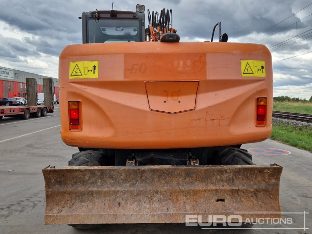 Hitachi ZX140W-3 - Pyöräalustainen kaivinkone: kuva  Hitachi ZX140W-3 - Pyöräalustainen kaivinkone Hitachi ZX140W-3 - Pyöräalustainen kaivinkone: kuva  Hitachi ZX140W-3 - Pyöräalustainen kaivinkone