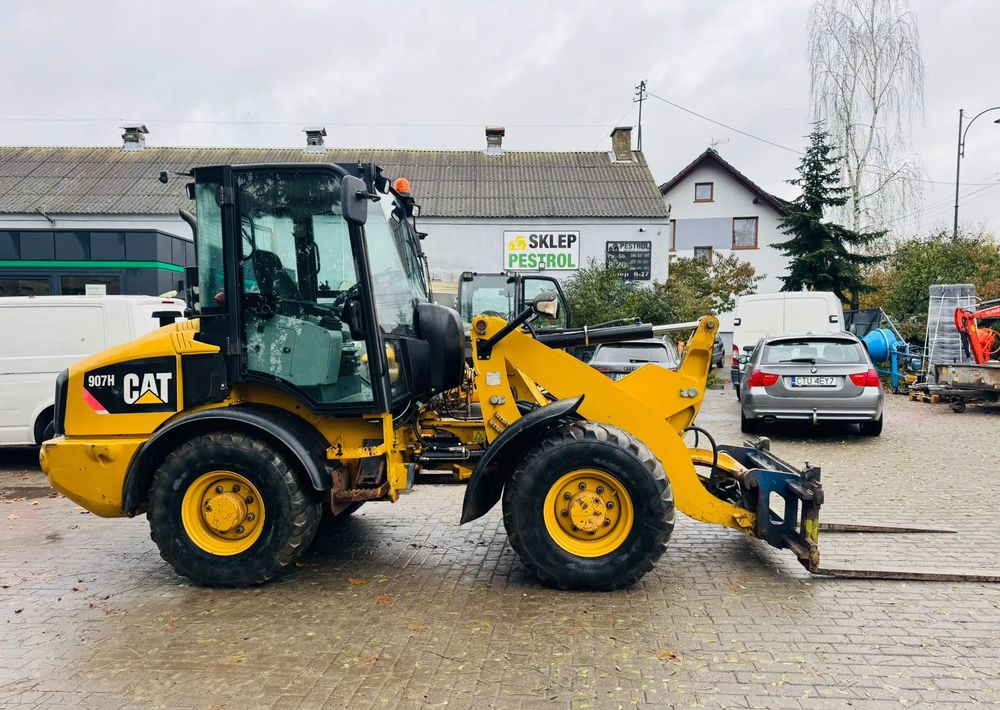 Caterpillar 907H - Pyöräkuormaaja: kuva  Caterpillar 907H - Pyöräkuormaaja Caterpillar 907H - Pyöräkuormaaja: kuva  Caterpillar 907H - Pyöräkuormaaja