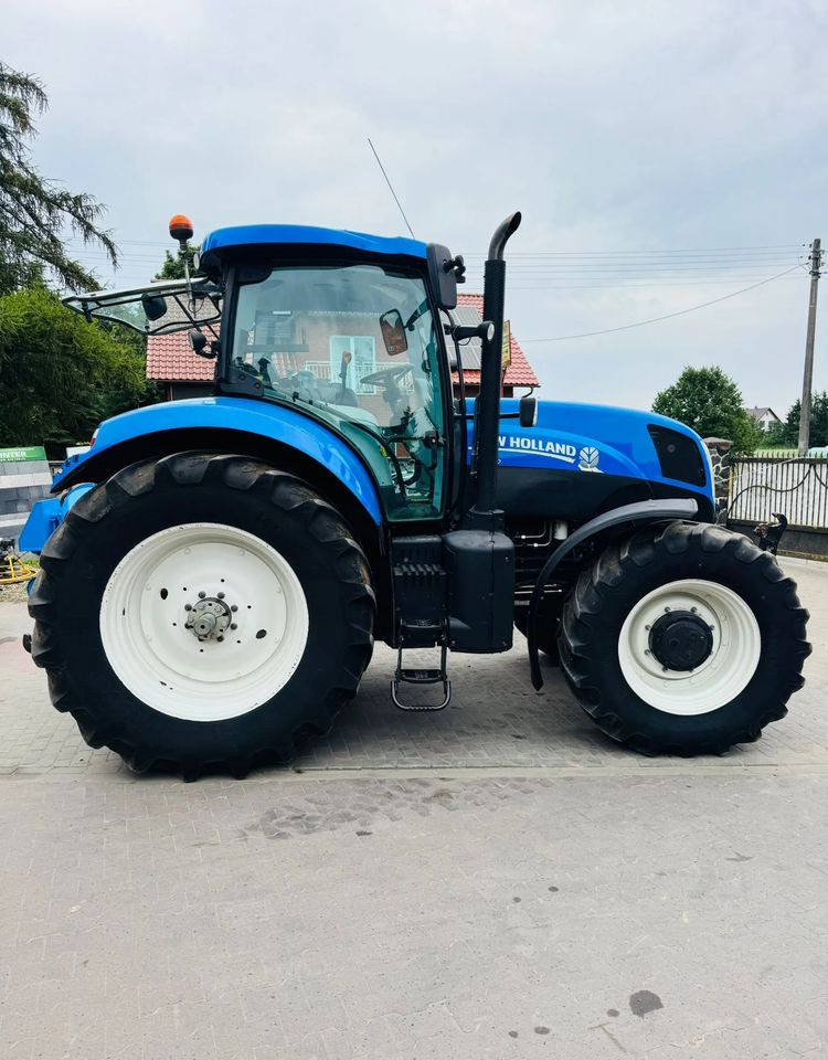 New Holland T7.210 - Traktori: kuva New Holland T7.210 - Traktori New Holland T7.210 - Traktori: kuva New Holland T7.210 - Traktori