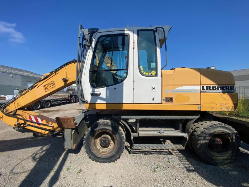 Liebherr A316Litronic - Pyöräalustainen kaivinkone: kuva Liebherr A316Litronic - Pyöräalustainen kaivinkone Liebherr A316Litronic - Pyöräalustainen kaivinkone: kuva Liebherr A316Litronic - Pyöräalustainen kaivinkone