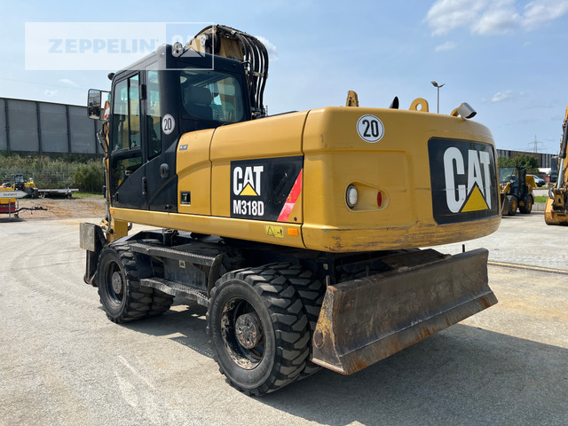 Cat M318D - Pyöräalustainen kaivinkone: kuva Cat M318D - Pyöräalustainen kaivinkone Cat M318D - Pyöräalustainen kaivinkone: kuva Cat M318D - Pyöräalustainen kaivinkone