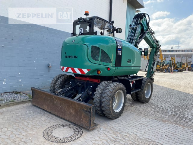 Pyöräalustainen kaivinkone Zeppelin ZM110: kuva Pyöräalustainen kaivinkone Zeppelin ZM110 Pyöräalustainen kaivinkone Zeppelin ZM110: kuva Pyöräalustainen kaivinkone Zeppelin ZM110